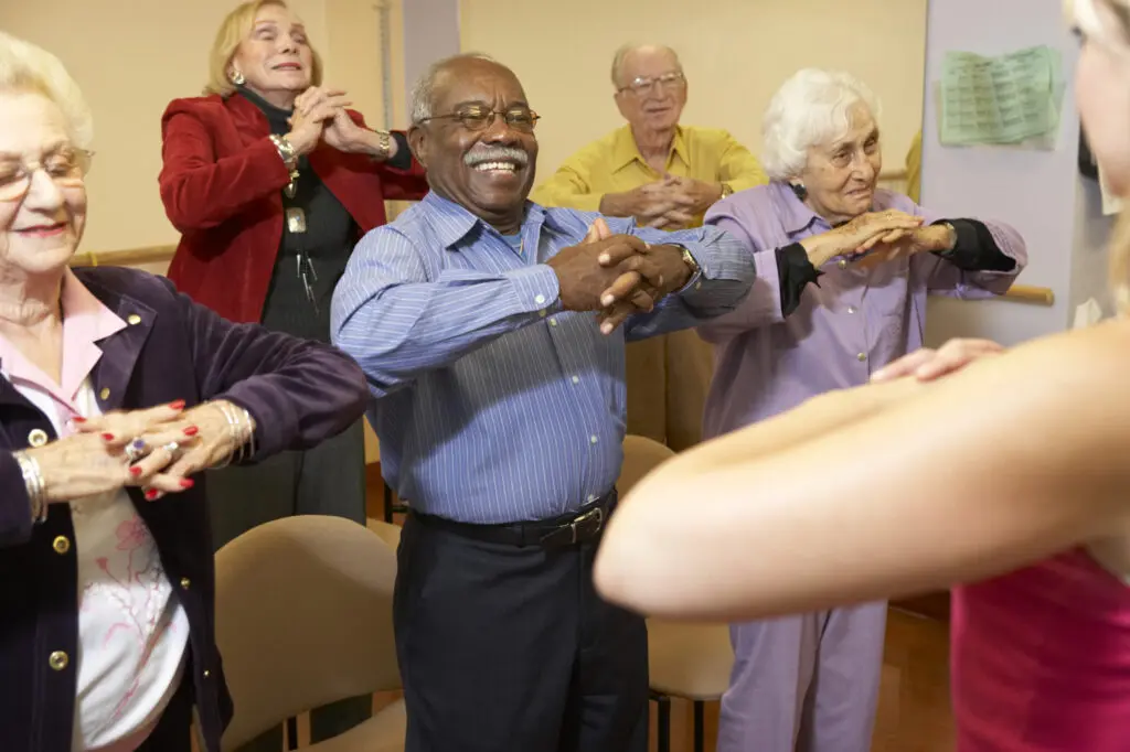 A senior man participates in an exercise class