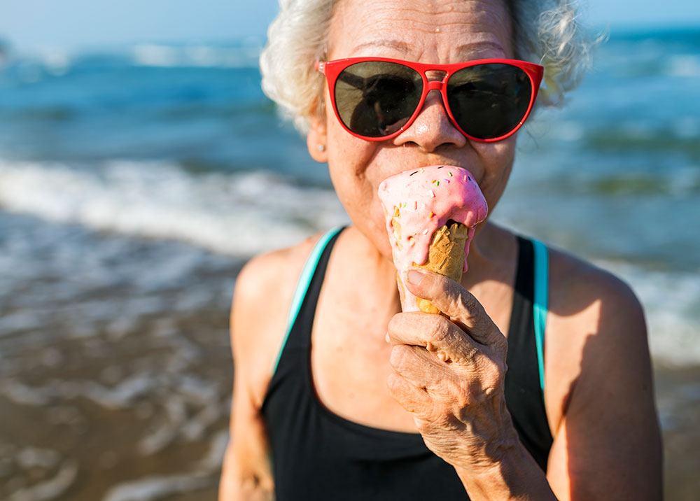 elderly woman eating ice cream