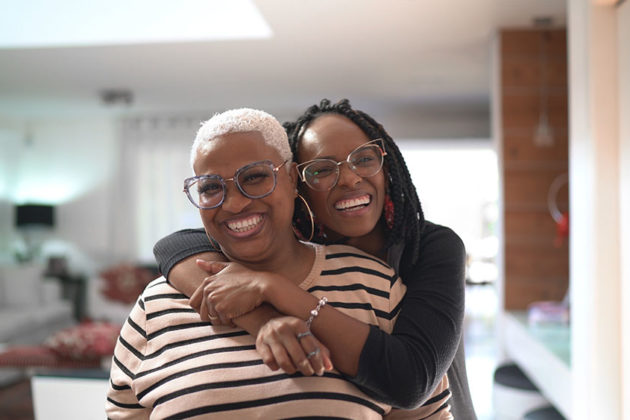 woman hugging another woman