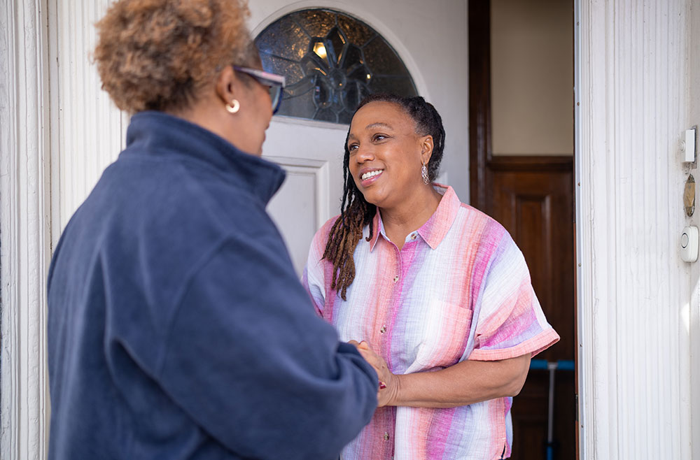 VNS Health team member and family member at the door.